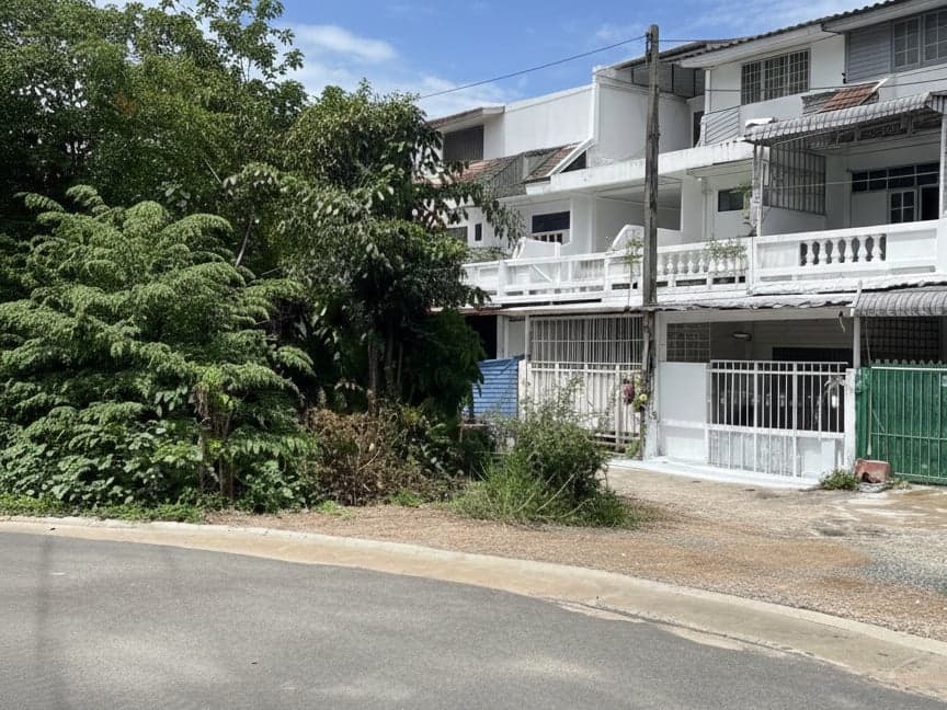 The street the house sits on, with neighbouring townhouses along it